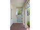 Charming enclosed gate and brick path with overhead trellis and white columns at 3011 Amherst Ave, Orlando, FL 32804