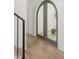 Arched doorway leading to a home office features wooden floors and modern aesthetic at 3011 Amherst Ave, Orlando, FL 32804