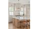 Stylish kitchen with a white tile backsplash, stainless steel appliances, and custom cabinetry at 3011 Amherst Ave, Orlando, FL 32804