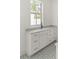 Laundry room with sleek white cabinets, stylish hardware, and a convenient sink area at 3011 Amherst Ave, Orlando, FL 32804