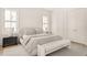 Bright main bedroom features a plush bed, coordinated furniture, and ample closet space at 3011 Amherst Ave, Orlando, FL 32804