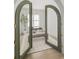 Elegant office space showcased through arched doorway with natural light and stylish decor at 3011 Amherst Ave, Orlando, FL 32804