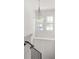Bright staircase landing with unique chandelier and natural light from two windows at 3011 Amherst Ave, Orlando, FL 32804