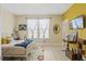 Bright bedroom with natural light, a white metal frame bed, and colorful decorative accents at 3321 Messina Dr, Lake Mary, FL 32746