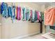 Walk-in closet with metal racks filled with clothing and storage at 3321 Messina Dr, Lake Mary, FL 32746