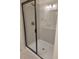 Modern bathroom shower with a glass enclosure and white subway tile at 3342 Pink Oleander, Mascotte, FL 34753