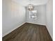 Dining room features wood-look flooring, neutral walls, and stylish chandelier lighting at 3447 Astoria Ct, Winter Park, FL 32792