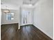 Inviting entryway boasts wood-look tile flooring, white walls, and modern lighting at 3447 Astoria Ct, Winter Park, FL 32792