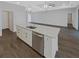 Kitchen island features quartz countertops, stainless steel appliances and white cabinetry at 3447 Astoria Ct, Winter Park, FL 32792