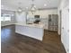 Modern kitchen with stainless steel appliances, white cabinets, and center island at 3447 Astoria Ct, Winter Park, FL 32792