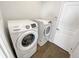 Laundry room with modern side-by-side washer and dryer for added convenience at 3447 Astoria Ct, Winter Park, FL 32792