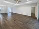 Spacious living room with wood-look floors, neutral walls, and recessed lighting at 3447 Astoria Ct, Winter Park, FL 32792