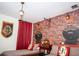 Whimsical themed bedroom with Hogwarts Express decor, brick wallpaper, and charming details for a magical touch at 351 Ocean Course Ave, Davenport, FL 33896