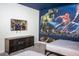 Themed bedroom featuring Marvel Avengers characters and sleek furniture for a fun and modern living space at 351 Ocean Course Ave, Davenport, FL 33896