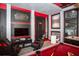 Game room with black and red themed interior design and Star Wars decor and gaming at 351 Ocean Course Ave, Davenport, FL 33896