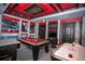 Open game room with a pool table, Star Wars themes, custom lighting, and bar area at 351 Ocean Course Ave, Davenport, FL 33896