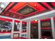 Fun game room with red ceiling, black accents and Star Wars decorations at 351 Ocean Course Ave, Davenport, FL 33896