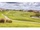 Picturesque view of a well-manicured golf course winding through a residential community at 351 Ocean Course Ave, Davenport, FL 33896