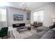 Contemporary living room showcasing modern furnishings, a large screen TV, and bright natural light at 351 Ocean Course Ave, Davenport, FL 33896