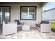 Cozy patio featuring comfortable seating, neutral colors, and a relaxing outdoor space at 351 Ocean Course Ave, Davenport, FL 33896