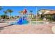 Community splash pad water park area with colorful structures and water features at 351 Ocean Course Ave, Davenport, FL 33896