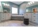 Serene bathroom featuring dual vanities, a soaking tub, and stylish fixtures at 352 Radisson Pl, Oviedo, FL 32765