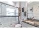 Modern bathroom featuring a shower/tub, granite sink, and tile accents at 352 Radisson Pl, Oviedo, FL 32765