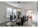 Dining room showcasing a modern table with elegant chairs and a contemporary chandelier at 352 Radisson Pl, Oviedo, FL 32765