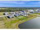 Neighborhood aerial shot of the backyard, showcasing a fence and lake views at 4228 Sunset Preserve Blvd, Orlando, FL 32820