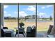 Covered back porch with a view of the water at 4228 Sunset Preserve Blvd, Orlando, FL 32820