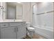 Bathroom featuring a gray vanity, tile floors, and a shower at 4228 Sunset Preserve Blvd, Orlando, FL 32820