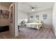 Cozy bedroom featuring a queen bed, a desk, and a ceiling fan at 4228 Sunset Preserve Blvd, Orlando, FL 32820