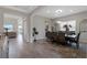 Elegant dining room with modern lighting, neutral walls, and seamless access to the living areas at 4228 Sunset Preserve Blvd, Orlando, FL 32820