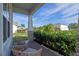 Inviting front porch with seating, lush landscaping, and a brick-paved walkway at 4228 Sunset Preserve Blvd, Orlando, FL 32820