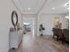 Open-concept living space with tile floors connecting the living room and dining area at 4228 Sunset Preserve Blvd, Orlando, FL 32820