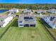 Beautiful rear exterior with expansive lawn and solar panels on home in desirable community at 4228 Sunset Preserve Blvd, Orlando, FL 32820