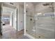 Marble shower with a built-in bench and glass doors in ensuite bathroom at 4228 Sunset Preserve Blvd, Orlando, FL 32820