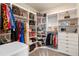 Bright walk-in closet featuring custom shelving and ample storage for clothes, shoes, and accessories at 4228 Sunset Preserve Blvd, Orlando, FL 32820