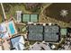 Aerial view highlighting the community's tennis courts, pool, recreation areas, and serene pond with fountain at 4909 Drawdy Ct, St Cloud, FL 34772