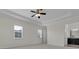 Spacious primary bedroom featuring a ceiling fan and an ensuite bathroom at 4909 Drawdy Ct, St Cloud, FL 34772