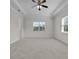 Bright, carpeted bedroom with recessed ceiling, large windows, and ensuite access at 4909 Drawdy Ct, St Cloud, FL 34772