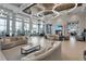 Expansive lobby featuring elegant sofas, contemporary design, a cozy fireplace, and an inviting atmosphere at 4909 Drawdy Ct, St Cloud, FL 34772