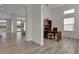 Bright office featuring wood-look tile flooring and a traditional wooden desk with built in shelving at 4909 Drawdy Ct, St Cloud, FL 34772