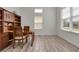 Well-lit office space with tile floors, a window with blinds, and a built-in wooden bookcase at 4909 Drawdy Ct, St Cloud, FL 34772