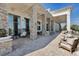 Inviting outdoor seating area with elegant chairs, stone pillars, and views of the pool at 4909 Drawdy Ct, St Cloud, FL 34772