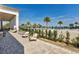 Poolside patio with lounge chairs and umbrellas overlooking a tranquil pool and beautiful landscaping at 4909 Drawdy Ct, St Cloud, FL 34772