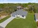 Aerial shot of a home featuring a well-manicured lawn and a modern gray roof at 505 St Johns Ct, Kissimmee, FL 34759