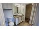 Bright bathroom showcasing a vessel sink, granite countertops, and ample cabinet space at 5526 G Nw Ave # 4915, Orlando, FL 32815