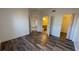 Bedroom with ensuite bathroom and walk-in closet, complemented by wood-look flooring at 5526 G Nw Ave # 4915, Orlando, FL 32815