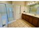 Bathroom features a double vanity and glass enclosed shower at 561 Telfair Square Ct, Sanford, FL 32771